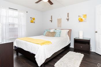 Beautiful bright bedroom with wide windows